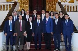 越南政府总理范明正会见在越南投资的大型外资企业领导人